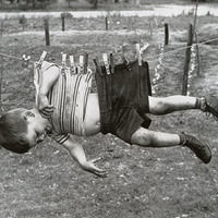 Thumb boy on clothesline  ca. 1950s 60s
