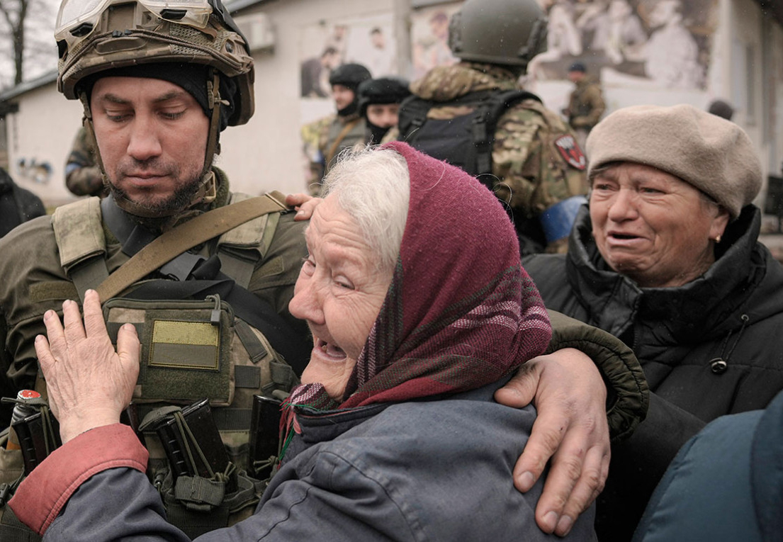 Украинские солдаты в Буче. Фото: Vadim Ghirda / ТАСС